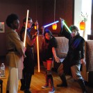 Dragon Jedi Performance Group pose with a fan at Lehigh Valley Fan Festival